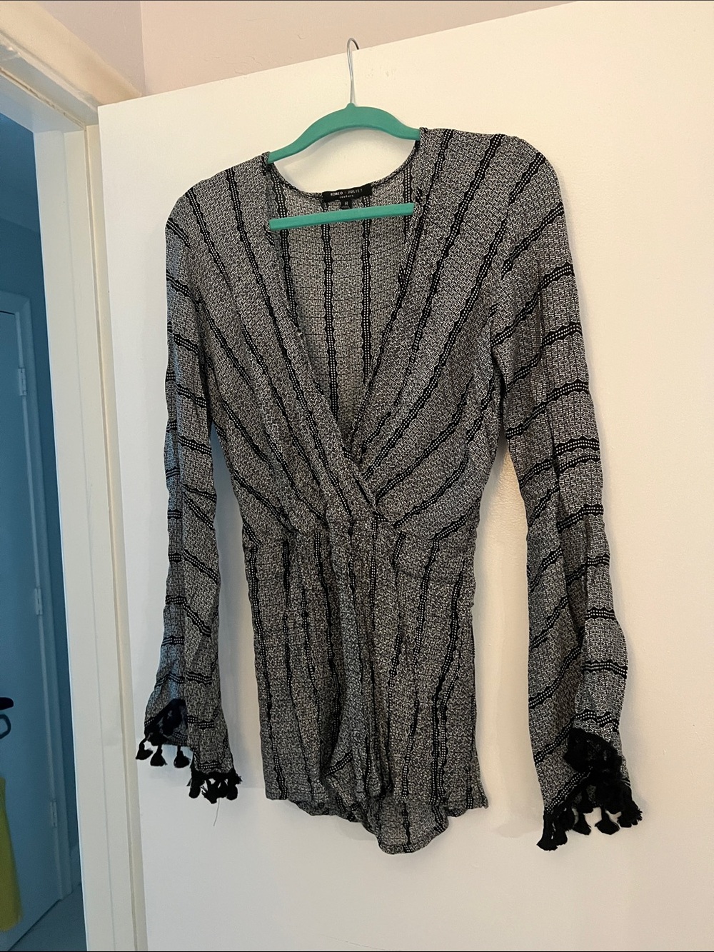 Striped Black & White Long-Sleeve Romper with Tassel Cuffs